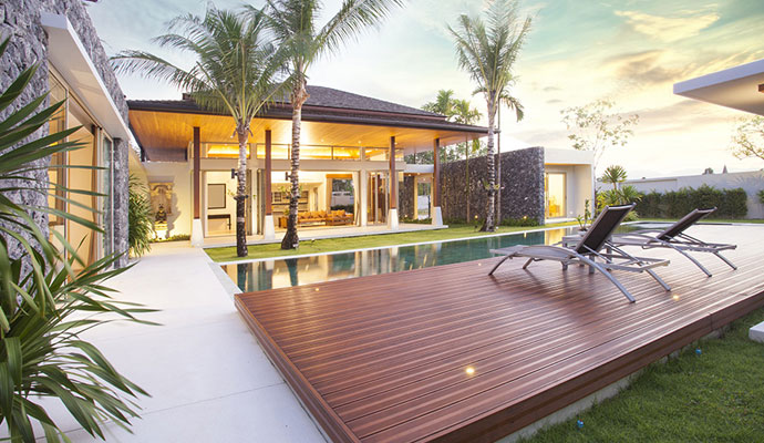 Modern resort-style home interior design with swimming pool and wooden deck